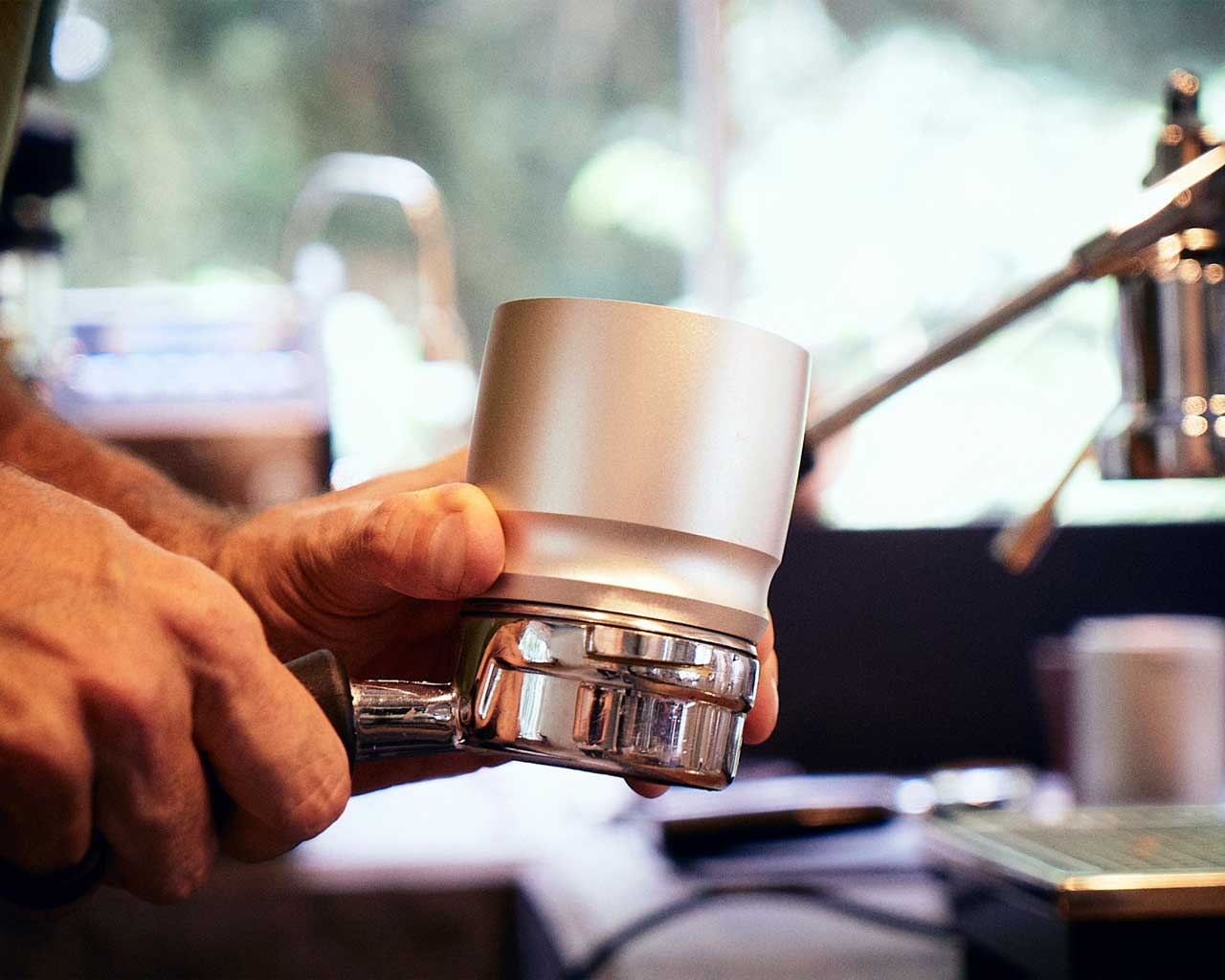 Blind Shaker in Silver dispensing coffee into portafilter [silver]